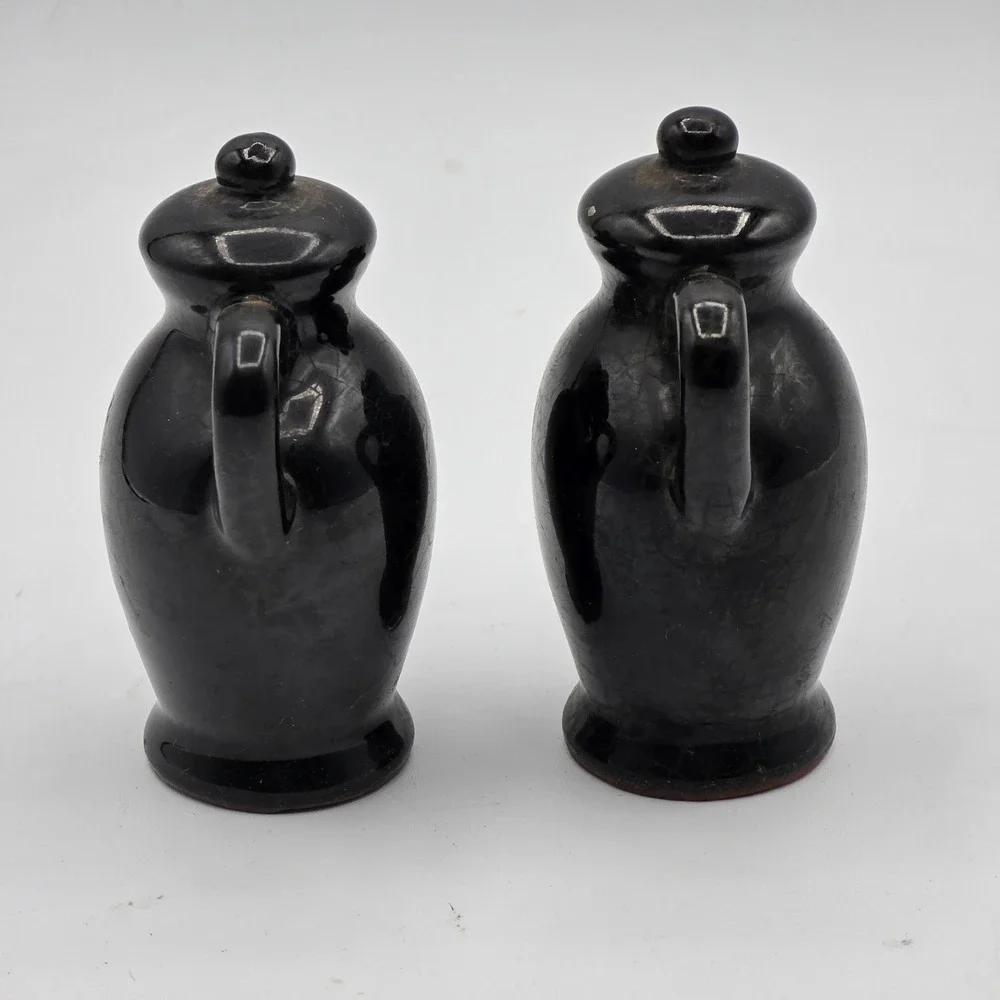 Vtg Black Glaze Ceramic Pottery Salt & Pepper Shakers Figural Jug Faces Set of 2